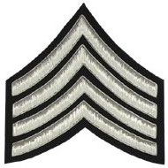 The 4 Stripe Chevrons Badge silver bullion black background